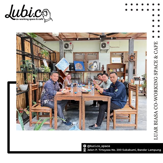 Modern coworking space interior with comfortable workspaces and natural lighting